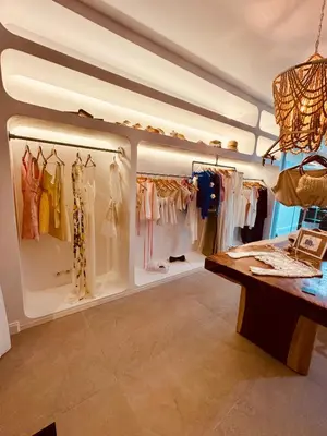 a dressing room with a lot of clothes on display at Maison LYO logement Luxe in Cannes