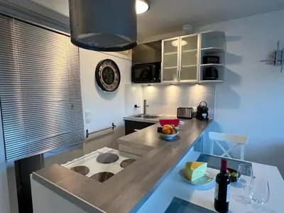 a kitchen with a counter with a sink and a counter top at Beau Soleil Standing Presta in Cannes