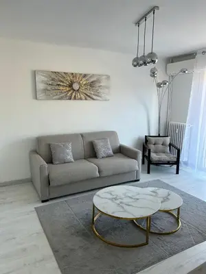 a living room with a couch and a coffee table at Marble elegancy in Cannes center in Cannes