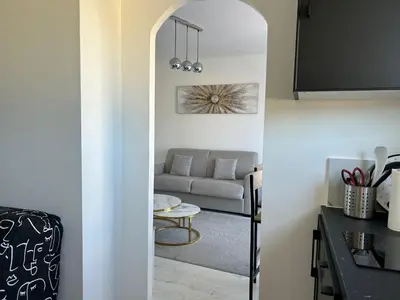 a living room with a couch and a table at Marble elegancy in Cannes center in Cannes