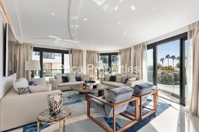 a living room with a couch and a table at Cannes Croisette 4 chambres luxe - 7C in Cannes