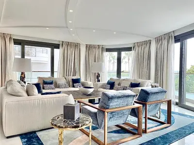 a living room with a couch and a table at Cannes Croisette 4 chambres luxe - 7C in Cannes