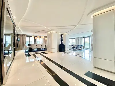 a large room with a lobby with black and white floors at Cannes Croisette 4 chambres luxe - 7C in Cannes
