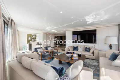 a living room with couches and a table at Cannes Croisette 4 chambres luxe - 7C in Cannes