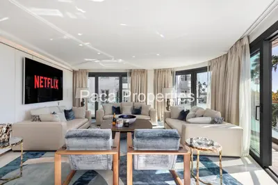 a living room with a couch and a table at Cannes Croisette 4 chambres luxe - 7C in Cannes