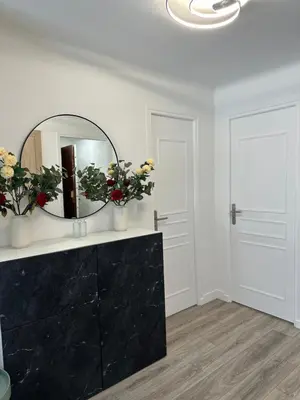 a bedroom with a white bed with two towels on it at Premium 80sqm Apartment Opposite Martinez, Steps from Congress Center in Cannes
