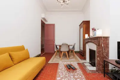 a living room with a couch and a table at Bessons in Cannes