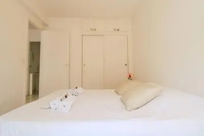 a white bed with two towels on top of it at Le Navarre By ApiRent #Terrasse #Ascenseur #Wifi in Cannes