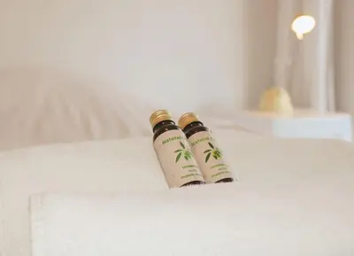 two bottles sitting on top of a bed at Le Navarre By ApiRent #Terrasse #Ascenseur #Wifi in Cannes