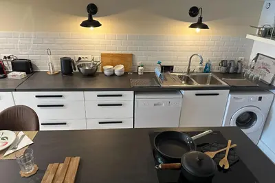 a kitchen with a sink and a washing machine at Spacious duplex near the city center of Cannes in Cannes