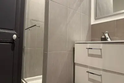 a bathroom with a shower and a sink at Charming T2 in the heart of city center in Cannes