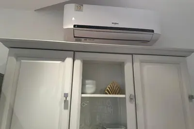 a microwave sitting on top of a cabinet at Charming T2 in the heart of city center in Cannes
