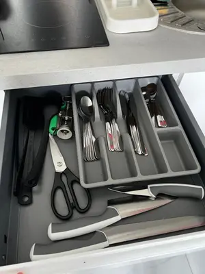 a drawer filled with utensils in a kitchen at Studio neuf centre Cannes 500 m plage in Cannes