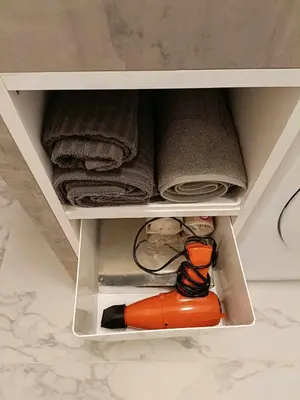 a white drawer with a tool in it at La Résidence Fleuries - Plage in Cannes