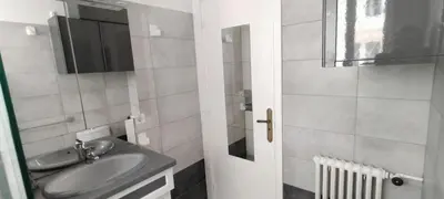 a bathroom with a sink and a mirror at T3 spacious 60 m near the beach of Cannes in Cannes