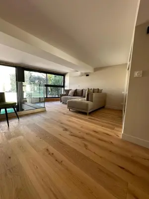 a living room with a couch and a table at Nice Living Cannes Plage in Cannes