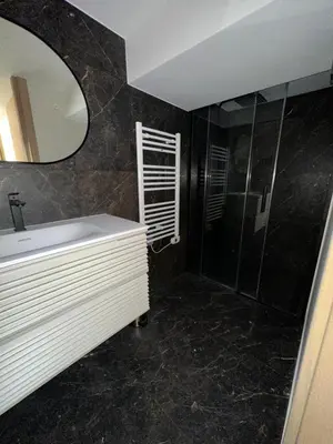 a bathroom with a sink and a mirror at Nice Living Cannes Plage in Cannes