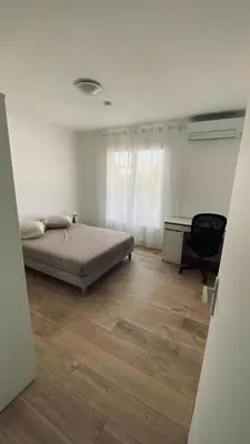 a bedroom with a bed and a desk and a chair at Joli 3pièces refait à neuf et très bien situé in Cannes