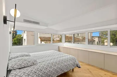 a white bedroom with windows and a bed at Luxueuse Villa L'Olivier Cannes 4 chambres jacuzzi in Cannes