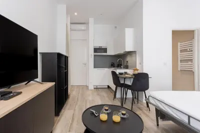 a living room with a couch and a table at 