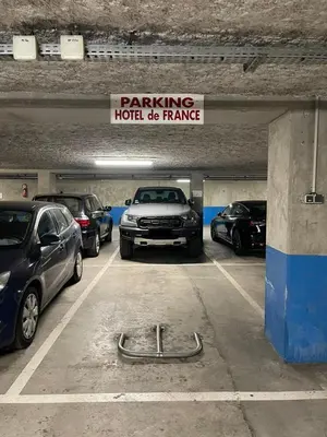a parking garage with cars parked in it at Edgar Suites Cannes - Rue d'Antibes in Cannes