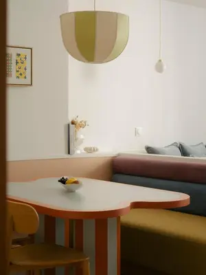 a table and chairs in a room with a couch at Edgar Suites Cannes - Rue d'Antibes in Cannes