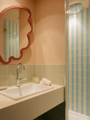 a bathroom with a sink and a shower at Edgar Suites Cannes - Rue d'Antibes in Cannes