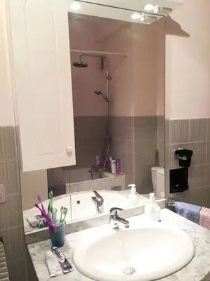 a bathroom with a sink and a mirror at Cannes 2pièces Croisette Martinez in Cannes