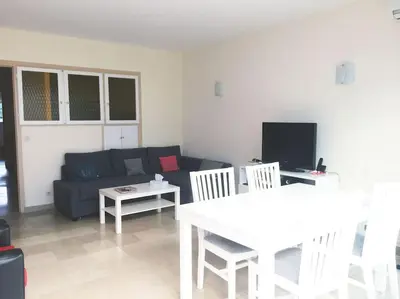 a living room with a couch and a table at Cannes 2pièces Croisette Martinez in Cannes