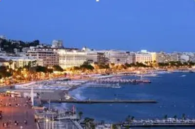 a view of a city with a beach and buildings at Cannes 2pièces Croisette Martinez in Cannes