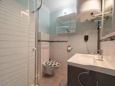 a bathroom with a toilet and a sink at Apartment Le Copacabana by Interhome in Cannes