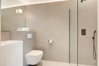 a bathroom with a toilet and a shower at Immogroom - 2 min du palais - Studio - Luxury - AC in Cannes