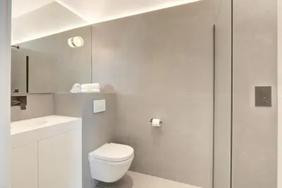 a bathroom with a white toilet and a sink at Immogroom - 2 min du palais - Studio - Luxury - AC in Cannes