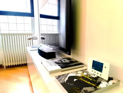 a desk with a computer and a laptop on it at Design Appartment 100sqm close to Palais Beach and Restaurants in Cannes
