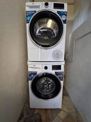 a washing machine and a dryer stacked on top of each other at Design Appartment 100sqm close to Palais Beach and Restaurants in Cannes