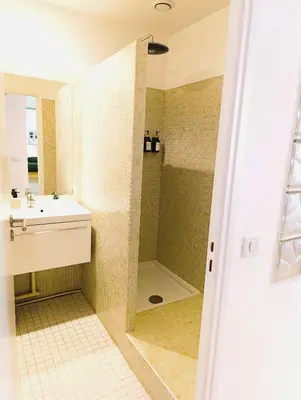 a bathroom with a shower and a sink at Design Appartment 100sqm close to Palais Beach and Restaurants in Cannes