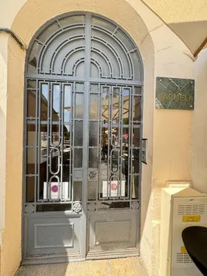 a door with a metal gate in a building at charmante suite vue mer villa Carmela in Cannes