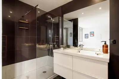 a bathroom with a sink and a shower at CASA RIVIERA Ecrin moderne ,tout confort, 300 m Croisette in Cannes