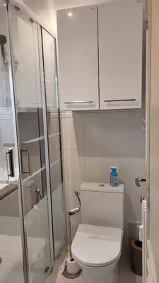 a bathroom with a toilet and a glass shower at Studio in Cannes