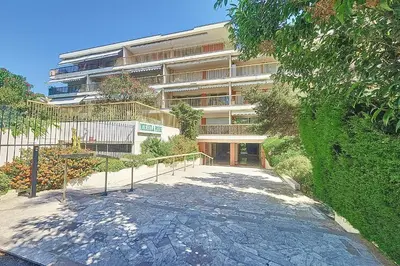 a large building with a walkway in front of it at Henri Camille Real Estate- Mikaela - Studio with terrace in Cannes
