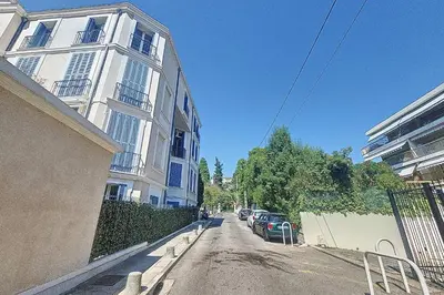 an empty street in front of a building at Henri Camille Real Estate- Mikaela - Studio with terrace in Cannes