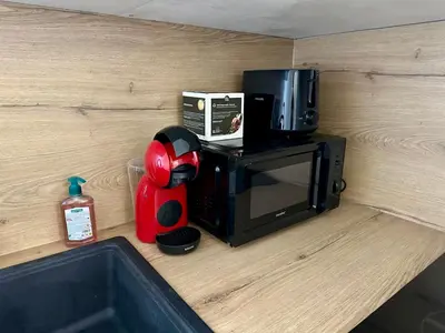 a microwave and a coffee maker sitting on a counter at 2 Bedrooms appartement entièrement rénové Cannes - 200m de la plage in Cannes