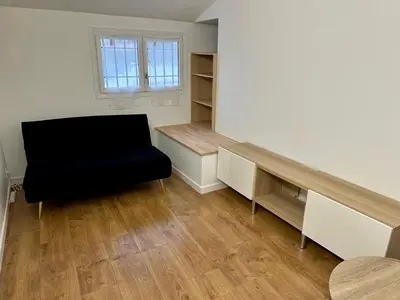 a living room with a desk and a chair at 2 Bedrooms appartement entièrement rénové Cannes - 200m de la plage in Cannes