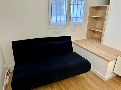 a black chair in a room with a window at 2 Bedrooms appartement entièrement rénové Cannes - 200m de la plage in Cannes