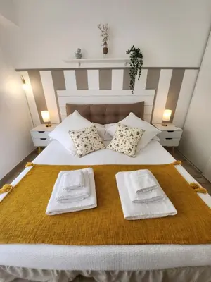 a bedroom with a bed with two towels on it at Cannes Paradis in Cannes