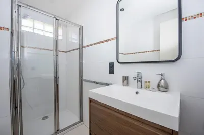 a bathroom with a sink and a shower at Studio Merlot - Welkeys in Cannes