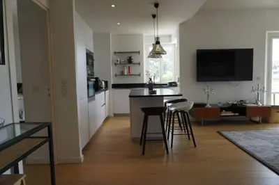 a kitchen and living room with a table and chairs at Best of the best in Cannes with a beautiful view in Cannes