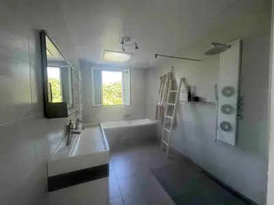 a white bathroom with a sink and a bath tub at Villa MARGARITTA 4km Cannes centre et plages in Le Cannet