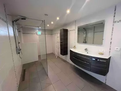 a bathroom with a shower and a sink and a mirror at Villa MARGARITTA 4km Cannes centre et plages in Le Cannet
