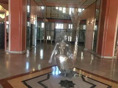 a statue of a woman sitting on the floor of a building at Cannes Croisette Miramar escape in Cannes